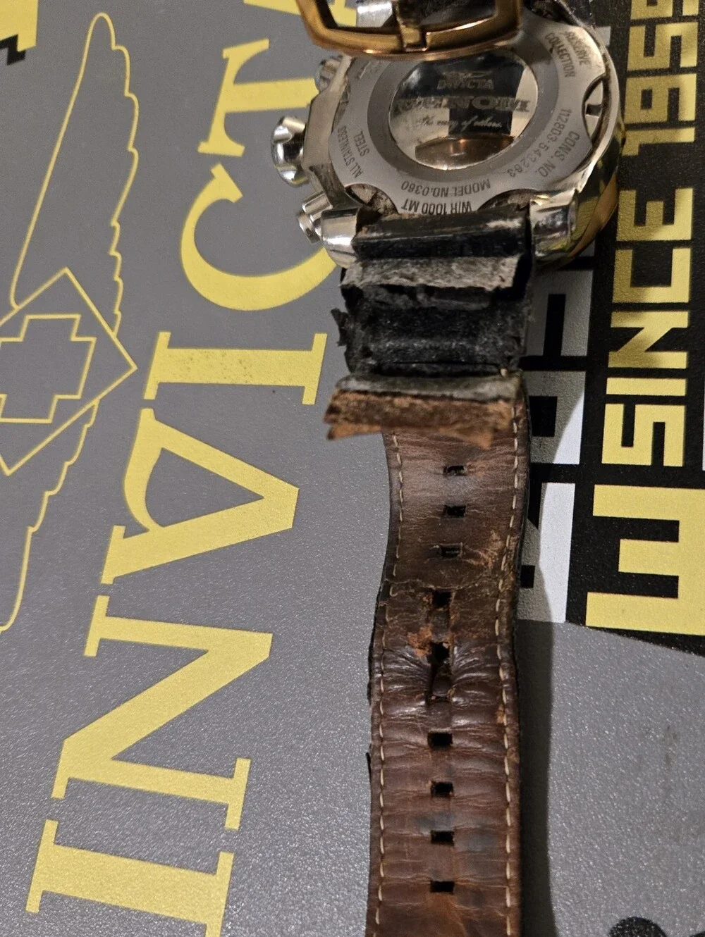 Invicta Gold and Black Chronograph Watch with Black Leather Strap. Needs Strsp